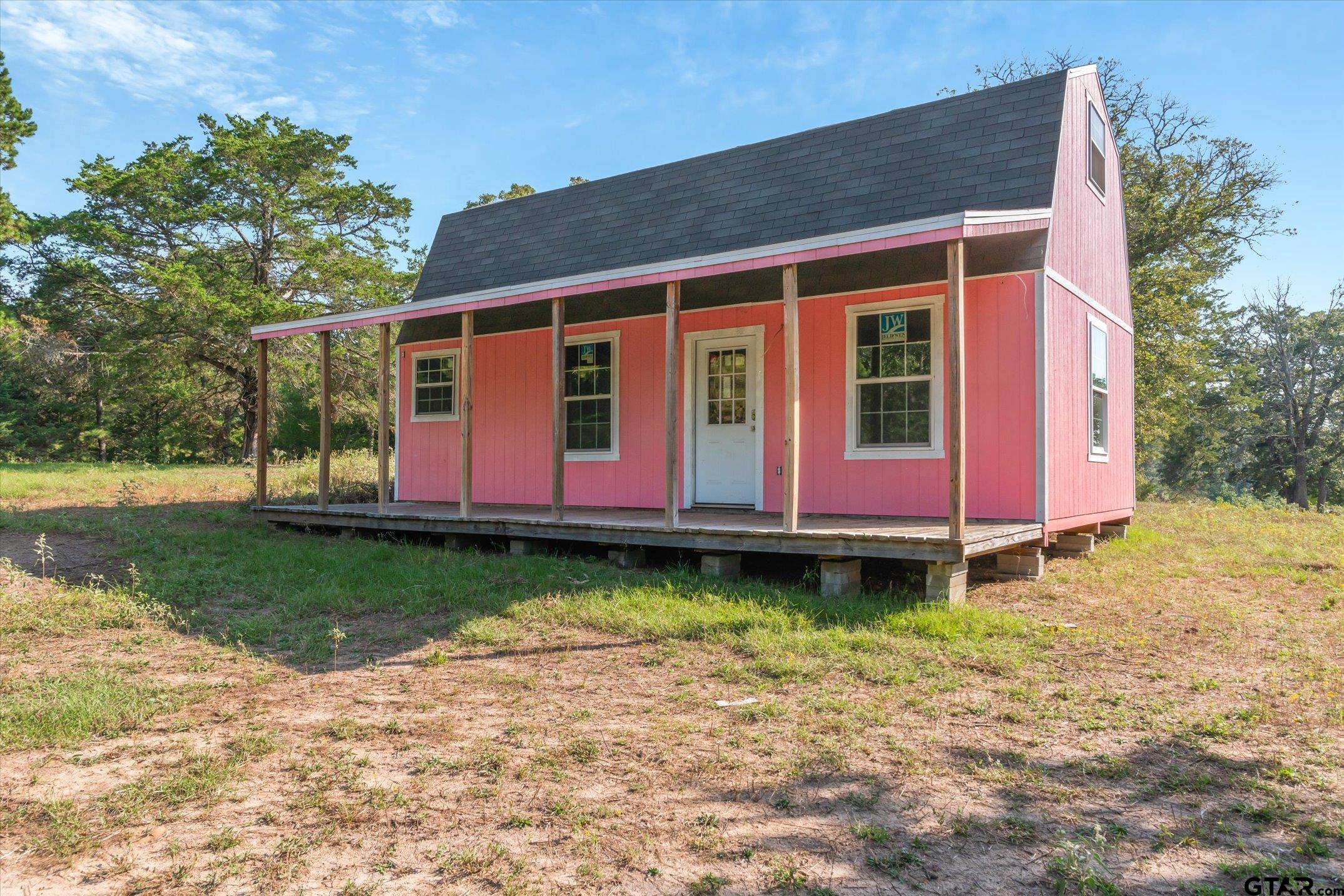 1936 Silver Maple Road Big Sandy, TX 75755 - Photo 43 of 48 a house with garden in front of it