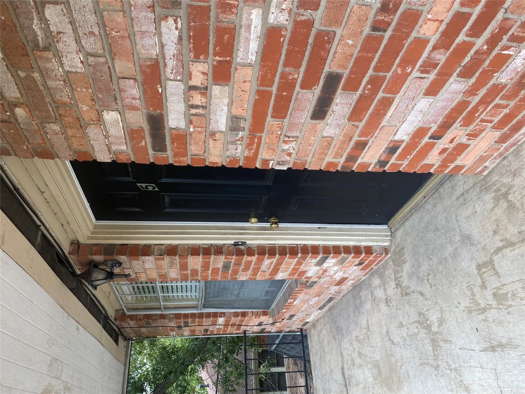 1601 Enfield Road, Unit 5 Austin, TX 78703 - Photo 1 of 20 Doorway to property with brick siding and a porch
