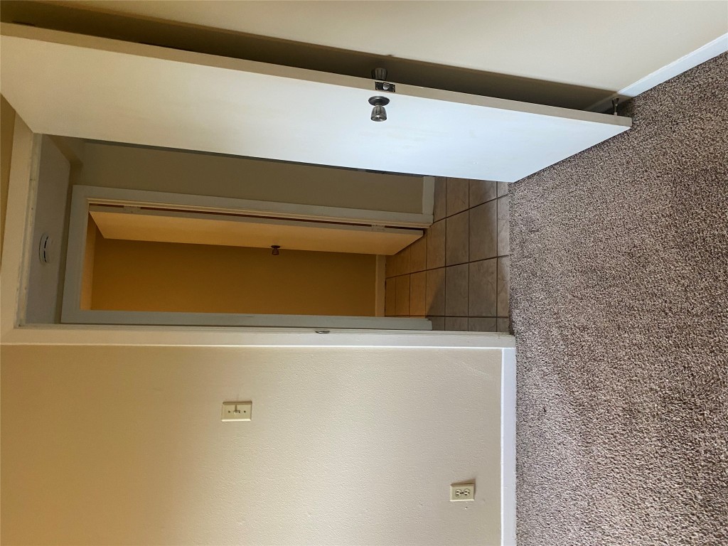 1601 Enfield Road, Unit 5 Austin, TX 78703 - Photo 11 of 20 Hall featuring light carpet and baseboards