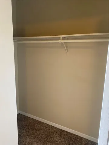 a view of a patio with a table and chairs