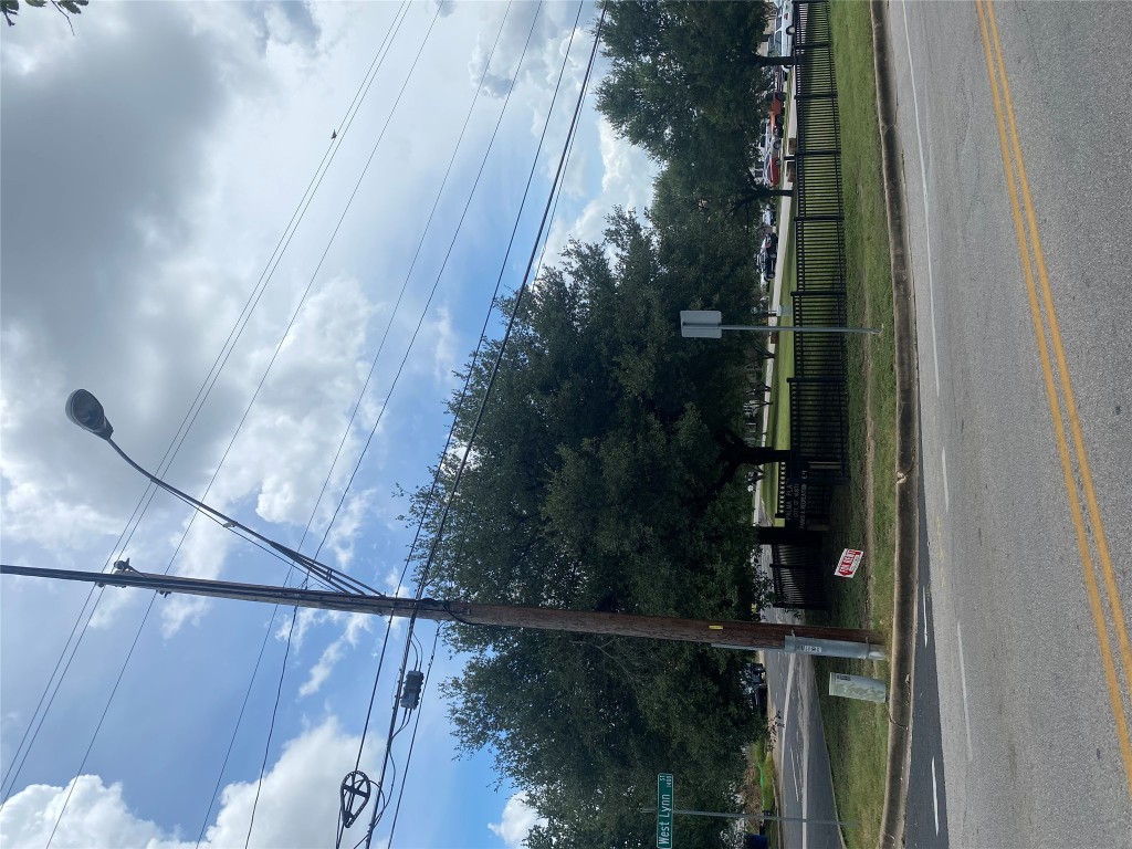 1601 Enfield Road, Unit 5 Austin, TX 78703 - Photo 20 of 20 View of asphalt street with curbs, street lighting, and traffic signs