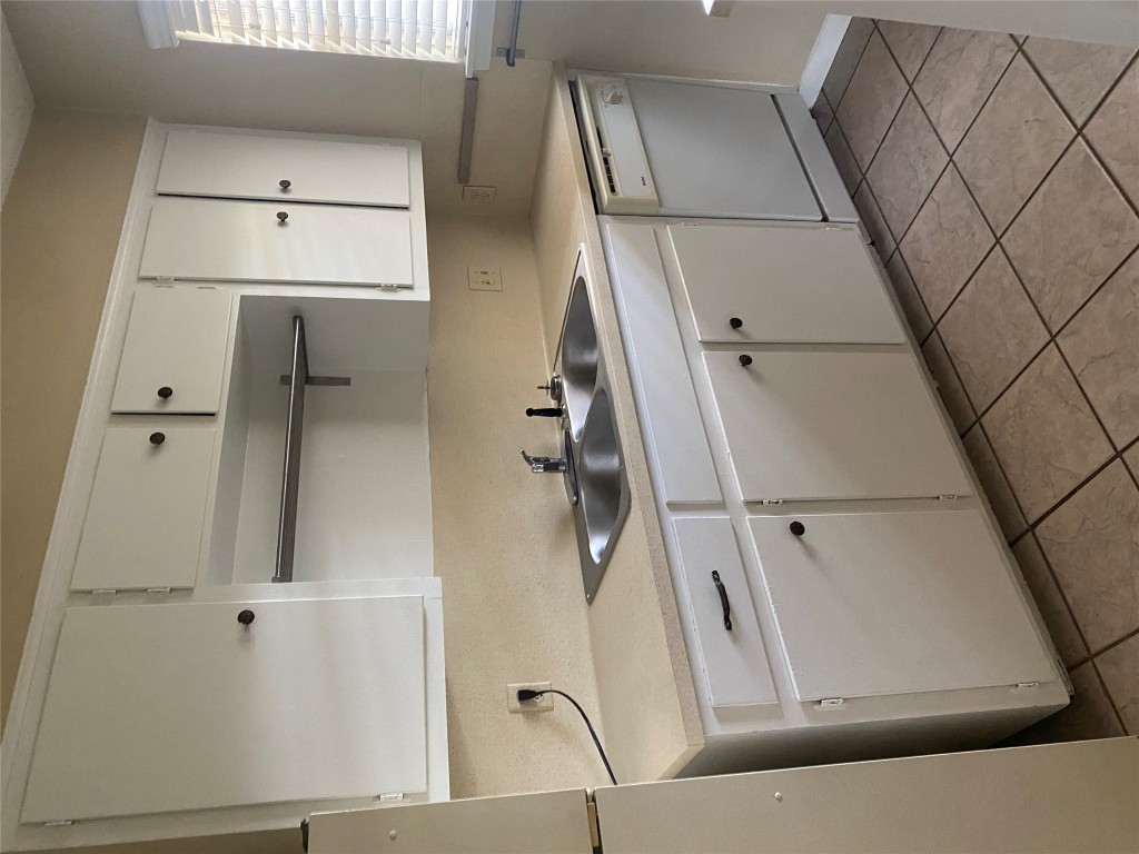 1601 Enfield Road, Unit 5 Austin, TX 78703 - Photo 7 of 20 Kitchen with white cabinetry, light countertops, white appliances, and light tile patterned floors