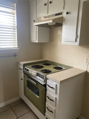 a view of an empty room with a bathroom