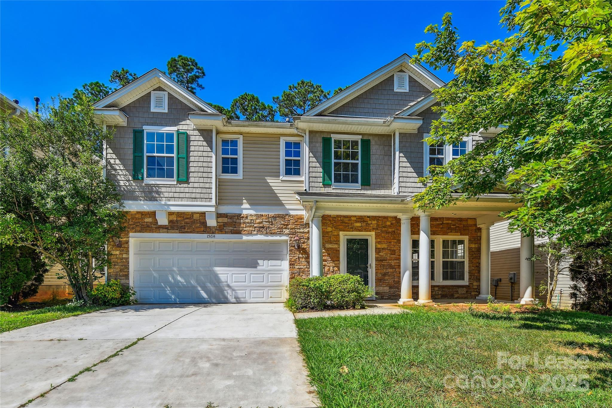 15614 Normans Landing Drive Charlotte, NC 28273 - Photo 1 of 21 a front view of a house with a yard
