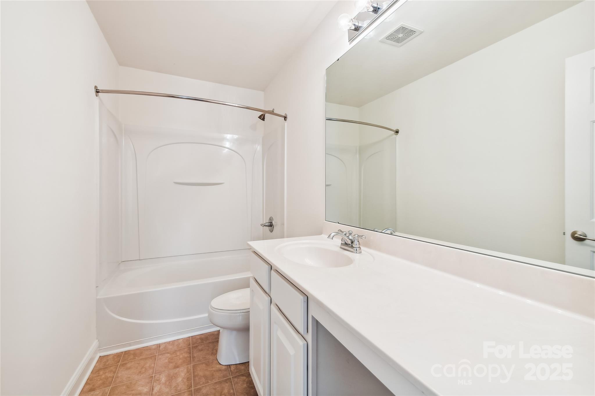 15614 Normans Landing Drive Charlotte, NC 28273 - Photo 15 of 21 a bathroom with a sink a toilet and shower