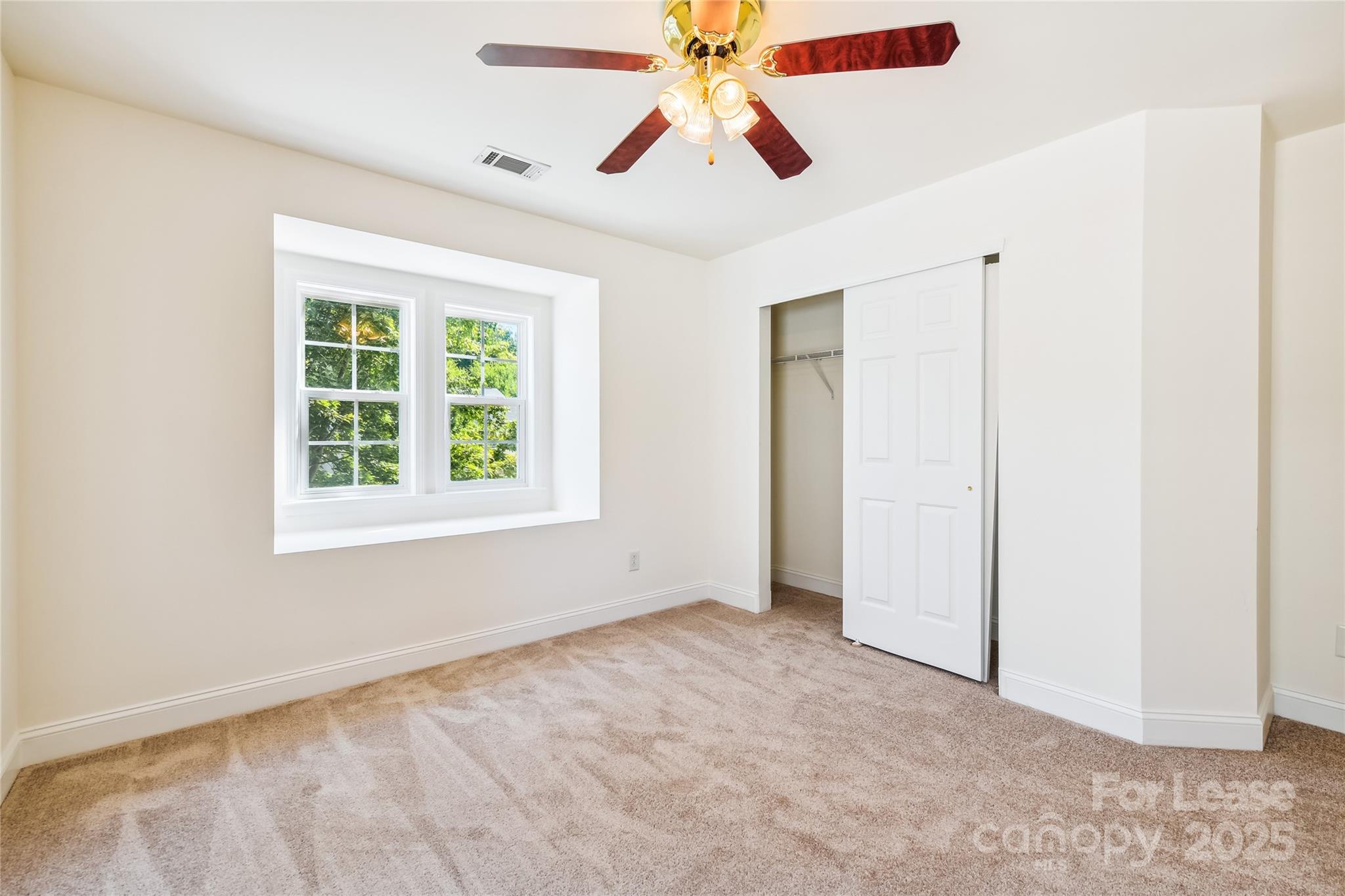 15614 Normans Landing Drive Charlotte, NC 28273 - Photo 16 of 21 an empty room with fan and windows
