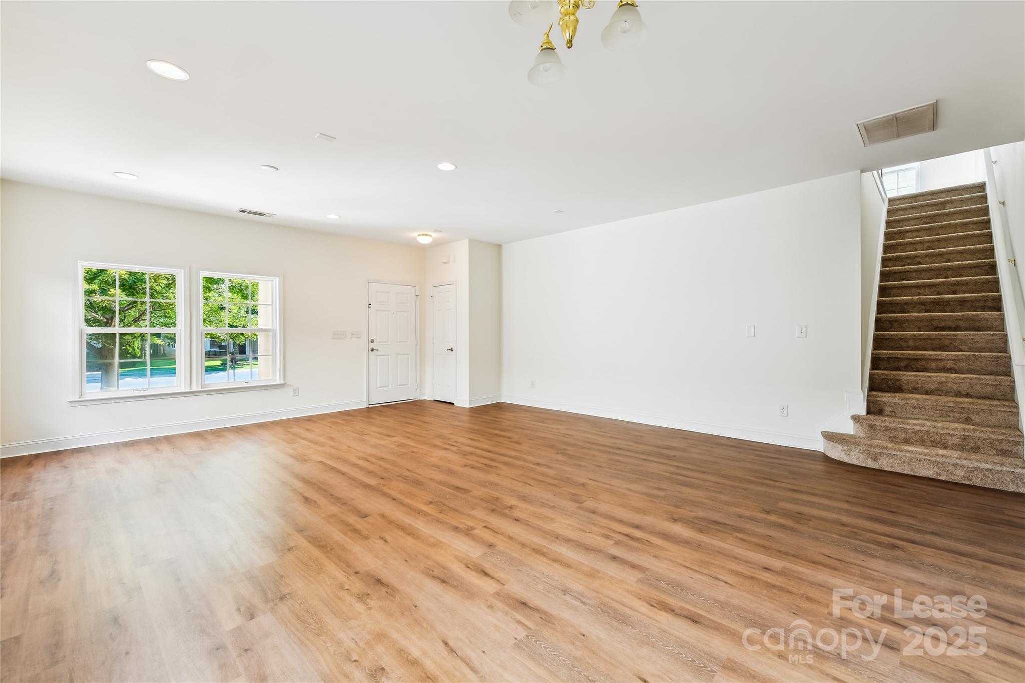 15614 Normans Landing Drive Charlotte, NC 28273 - Photo 5 of 21 wooden floor in an empty room with a window