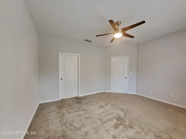 a view of a big room with carpet