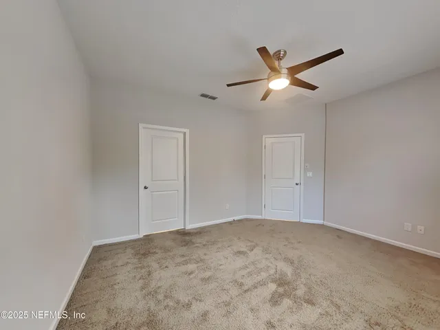 a view of a big room with carpet