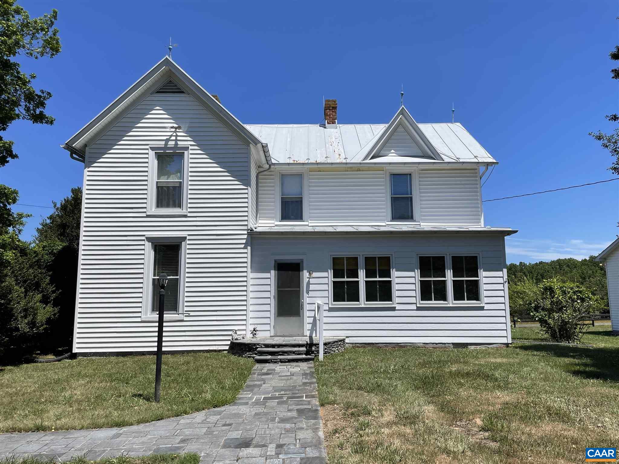 772 Poplar Spring Road Scottsville, VA 24590 - Photo 1 of 74 a front view of a house with a yard
