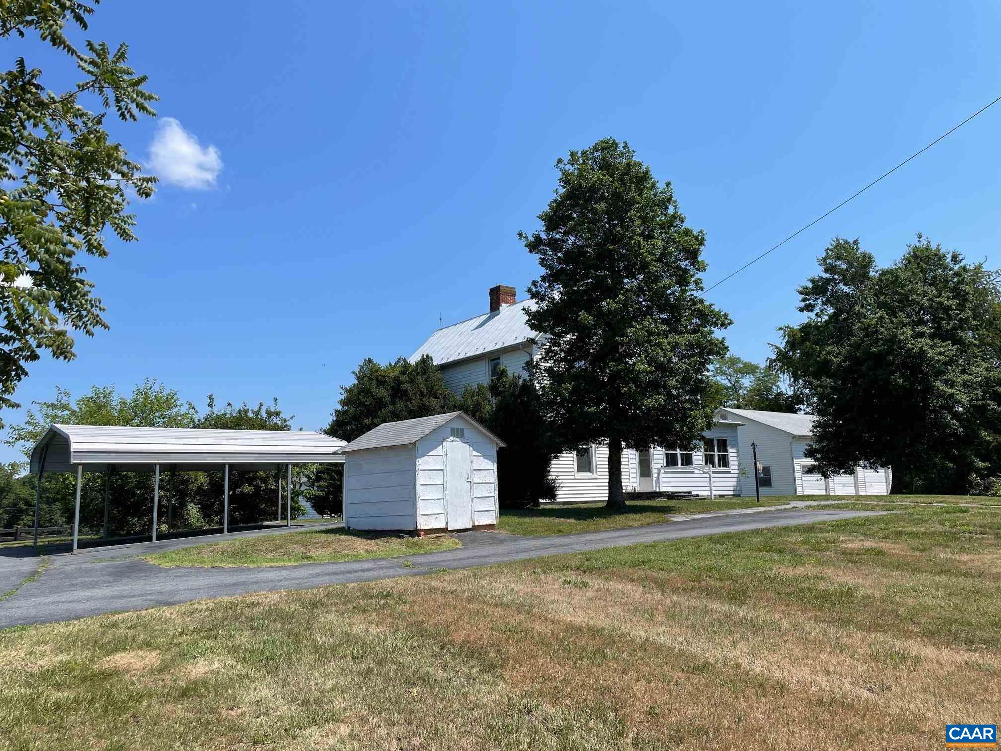 772 Poplar Spring Road Scottsville, VA 24590 - Photo 46 of 74 a front view of a house with a yard