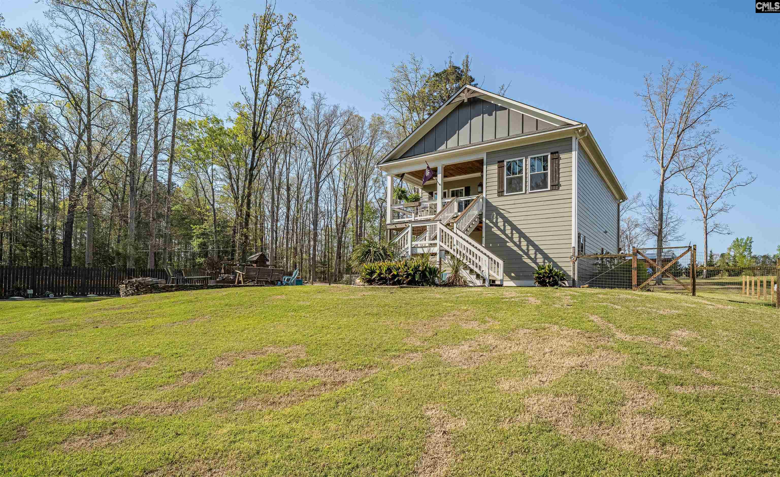 649 Sandbar Road Chapin, SC 29036 - Photo 31 of 40 a front view of a house with a yard