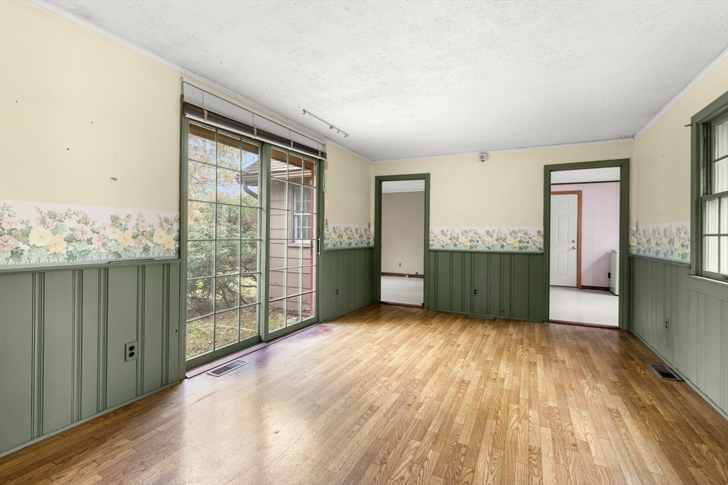 359 Kenoza Street Haverhill, MA 01830 - Photo 24 of 37 wooden floor in an empty room with a window