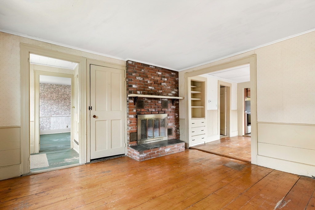 359 Kenoza Street Haverhill, MA 01830 - Photo 9 of 37 a view of an empty room with wooden floor and a window