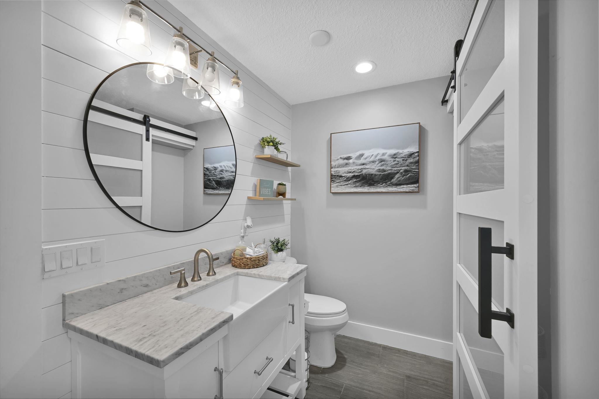 314 Arpieka Avenue St. Augustine, FL 32080 - Photo 15 of 28 a bathroom with a sink and a mirror