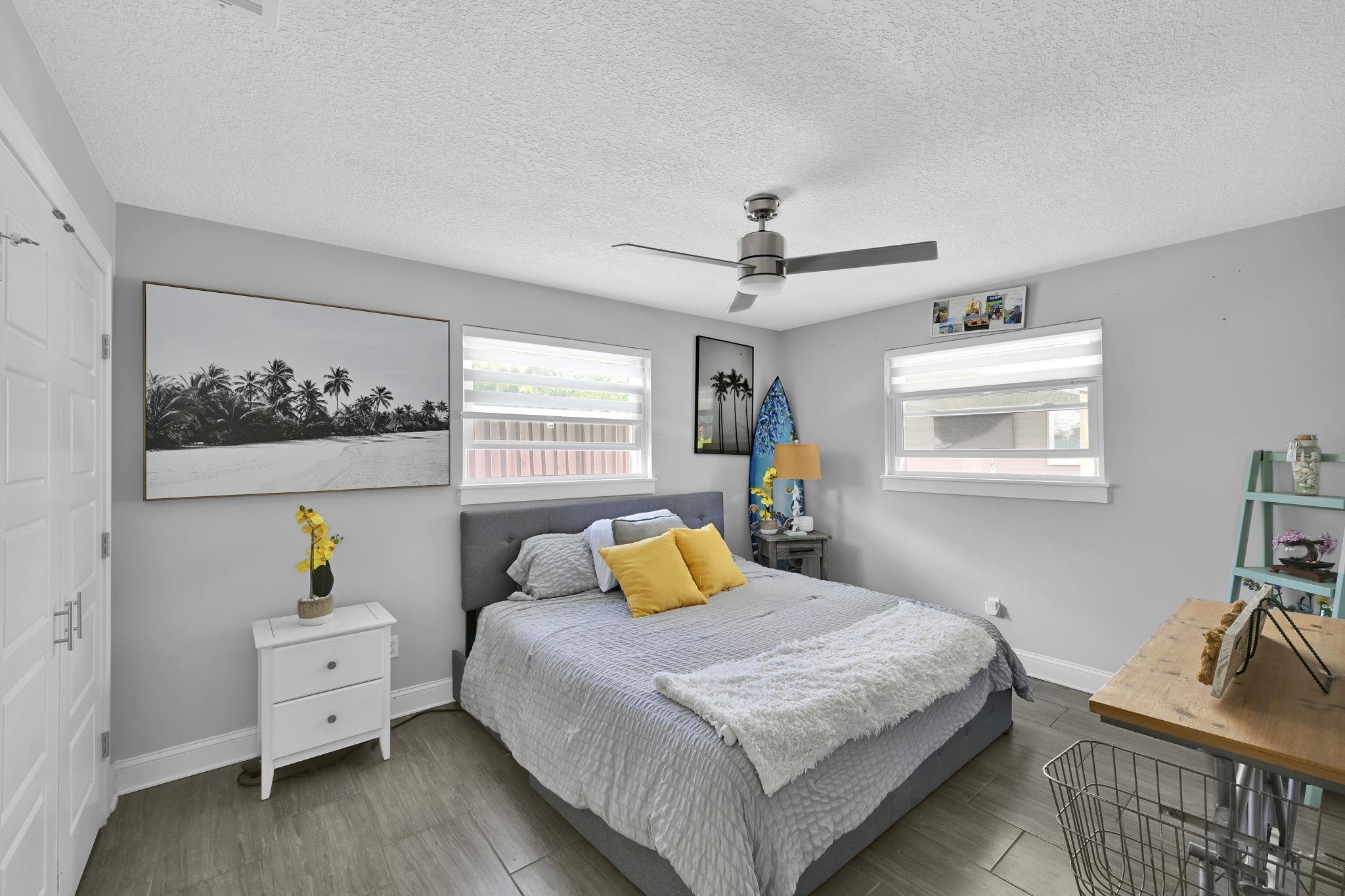 314 Arpieka Avenue St. Augustine, FL 32080 - Photo 17 of 28 a bedroom with a bed and wooden floor