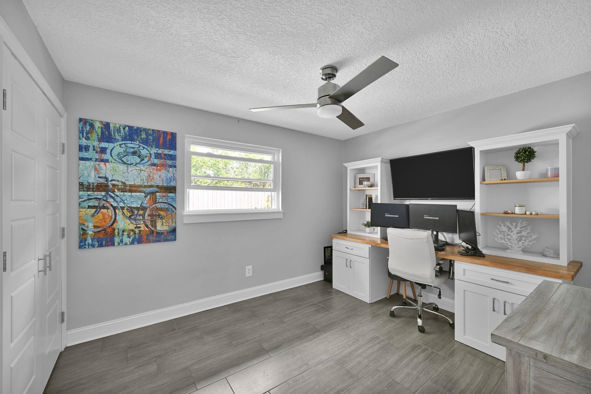 314 Arpieka Avenue St. Augustine, FL 32080 - Photo 18 of 28 a view of a workspace with furniture and a window