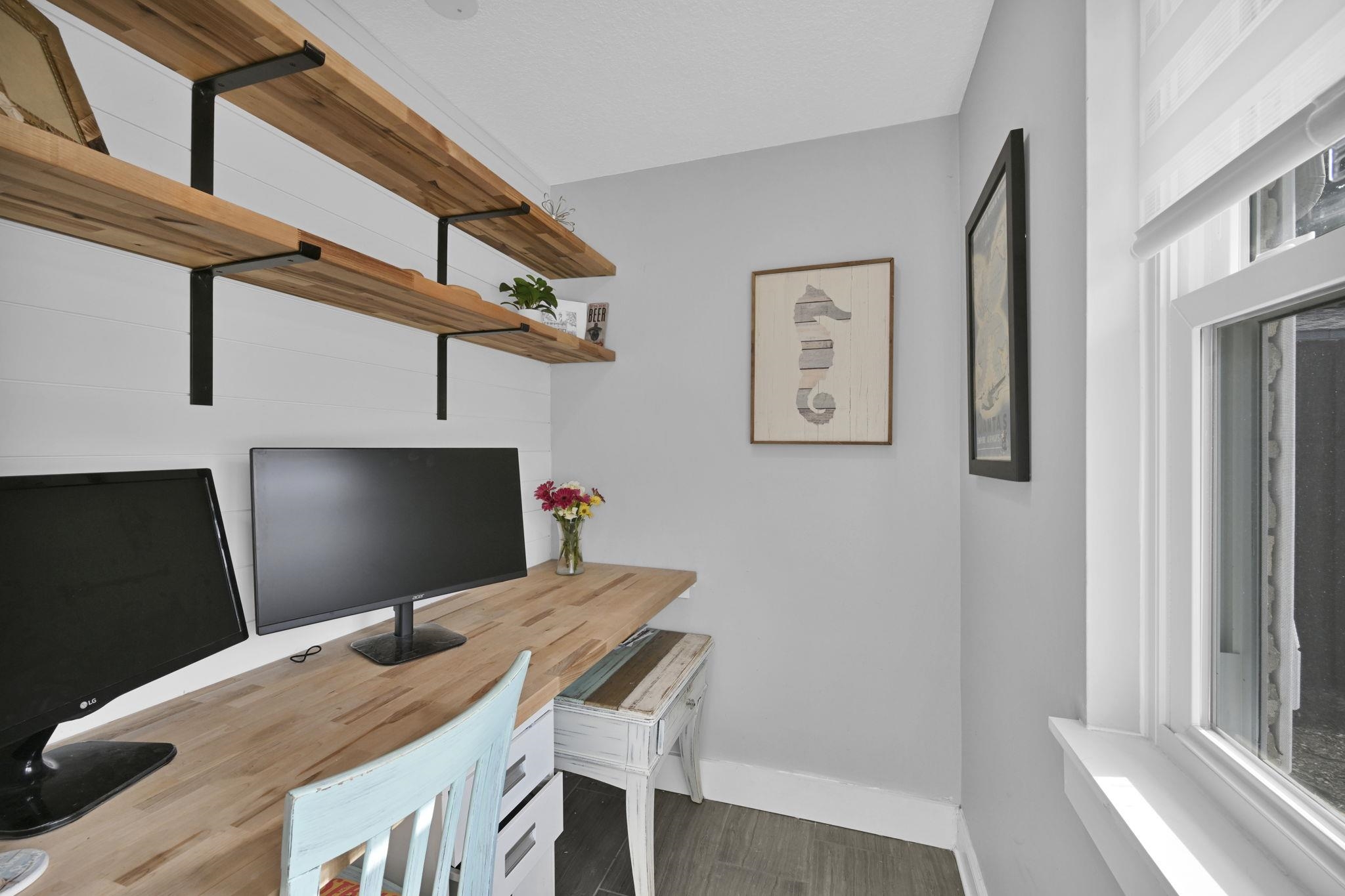 314 Arpieka Avenue St. Augustine, FL 32080 - Photo 7 of 28 a bedroom with a bed and a flat screen tv