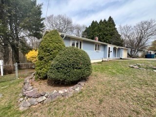 27 Sunset Drive Randolph, MA 02368 - Photo 29 of 37 a view of a house with a large tree and plants