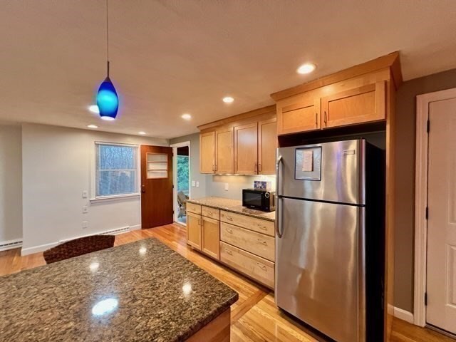 27 Sunset Drive Randolph, MA 02368 - Photo 7 of 37 a kitchen with stainless steel appliances granite countertop a refrigerator sink and stove