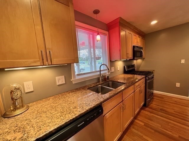 27 Sunset Drive Randolph, MA 02368 - Photo 10 of 37 a kitchen with stainless steel appliances granite countertop a sink and a wooden cabinets