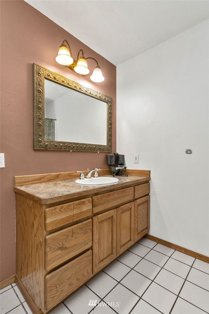 314 Spencer Road Toledo, WA 98591 - Photo 13 of 26 a bathroom with a sink and a mirror
