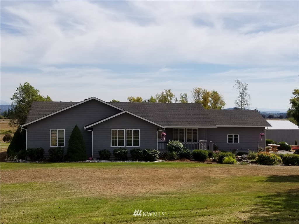 314 Spencer Road Toledo, WA 98591 - Photo 3 of 26 a front view of a house with a yard