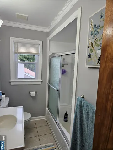 a bathroom with a shower and a toilet