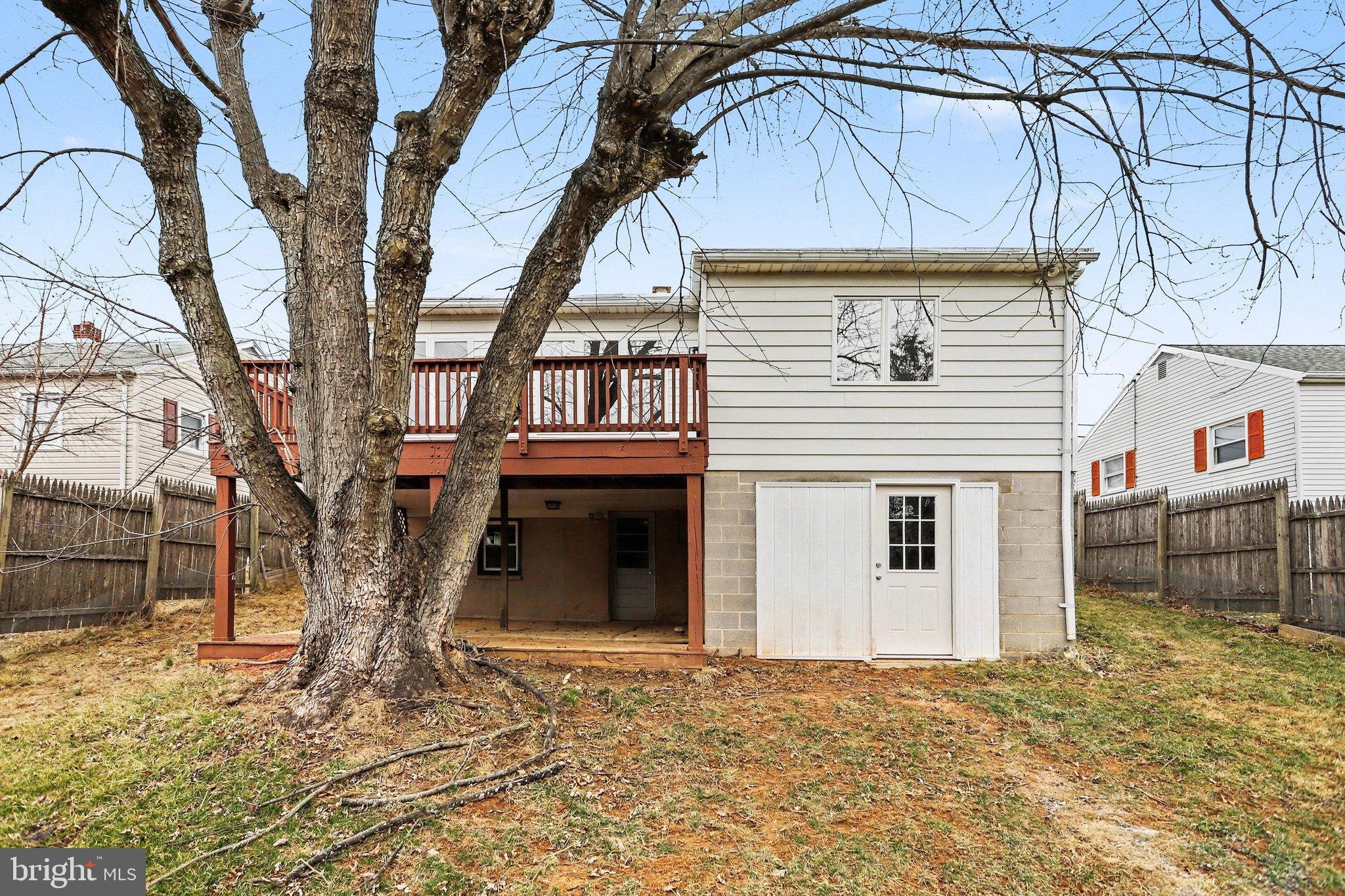 43 West High Street Windsor, PA 17366 - Photo 31 of 46 Charming backyard with spacious deck and tree.