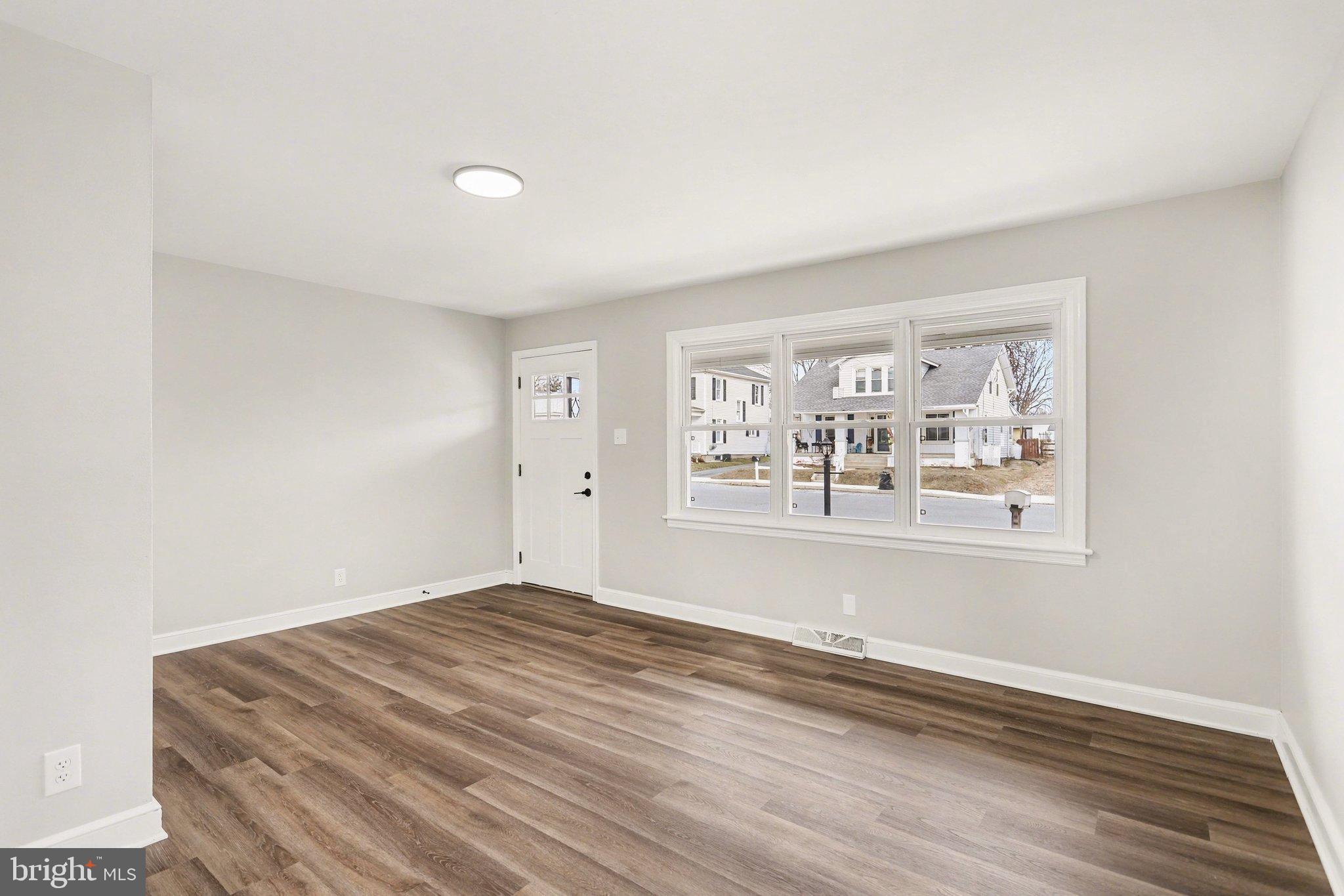 43 West High Street Windsor, PA 17366 - Photo 9 of 46 Bright and airy living space with new flooring.