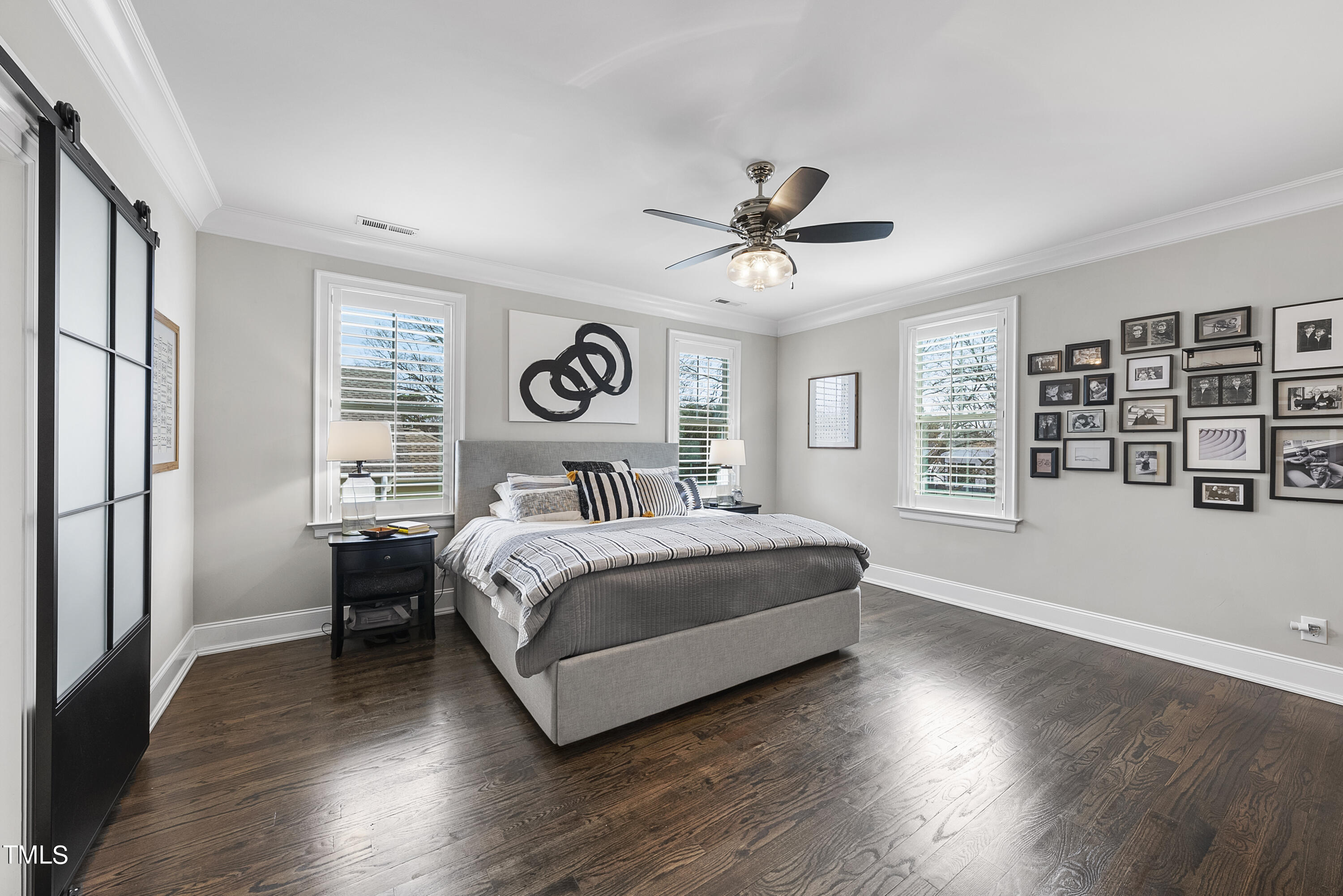 512 Mial Street Raleigh, NC 27608 - Photo 14 of 32 a bedroom with a large bed and a window