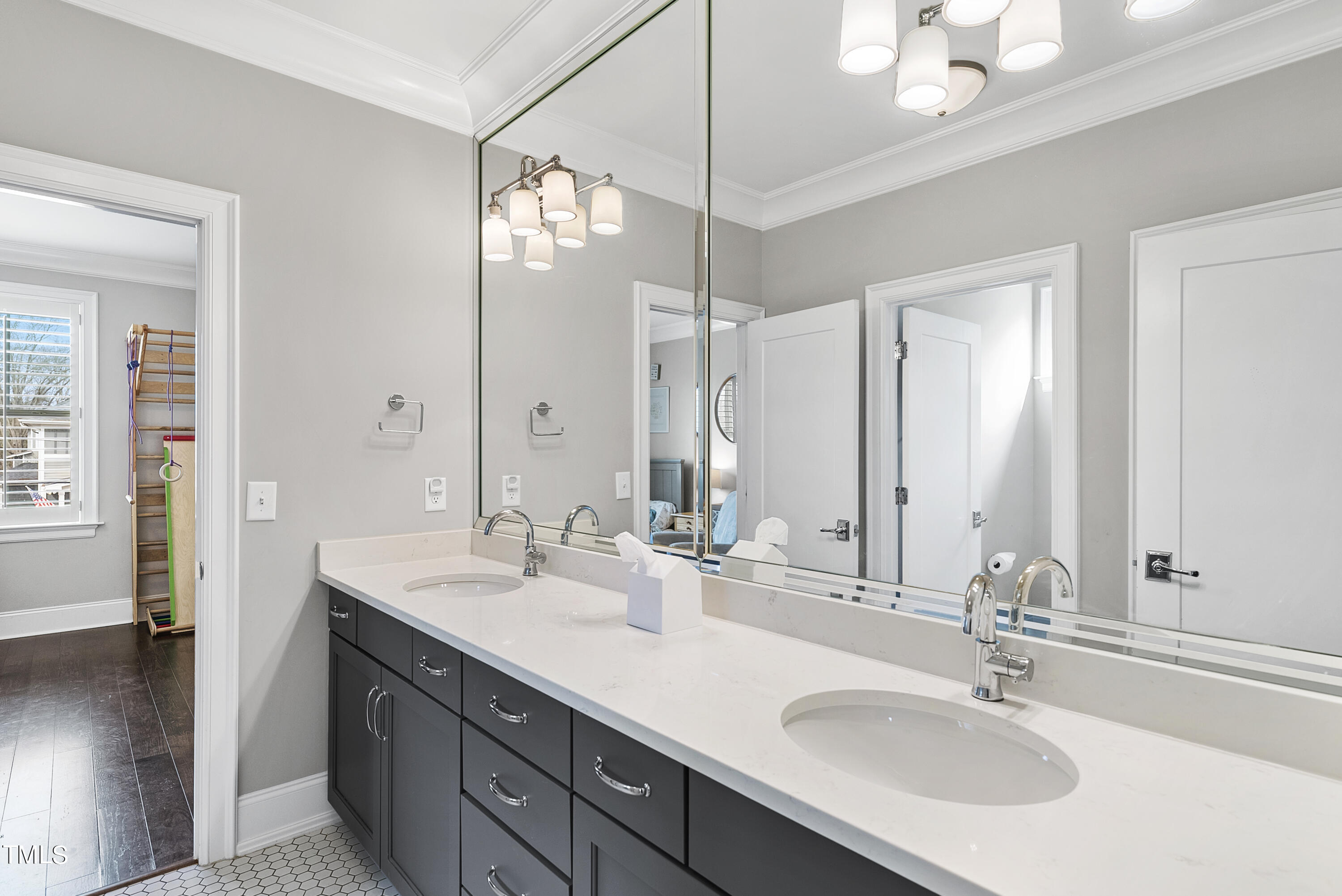 512 Mial Street Raleigh, NC 27608 - Photo 17 of 32 a bathroom with double vanity sinks and a mirror