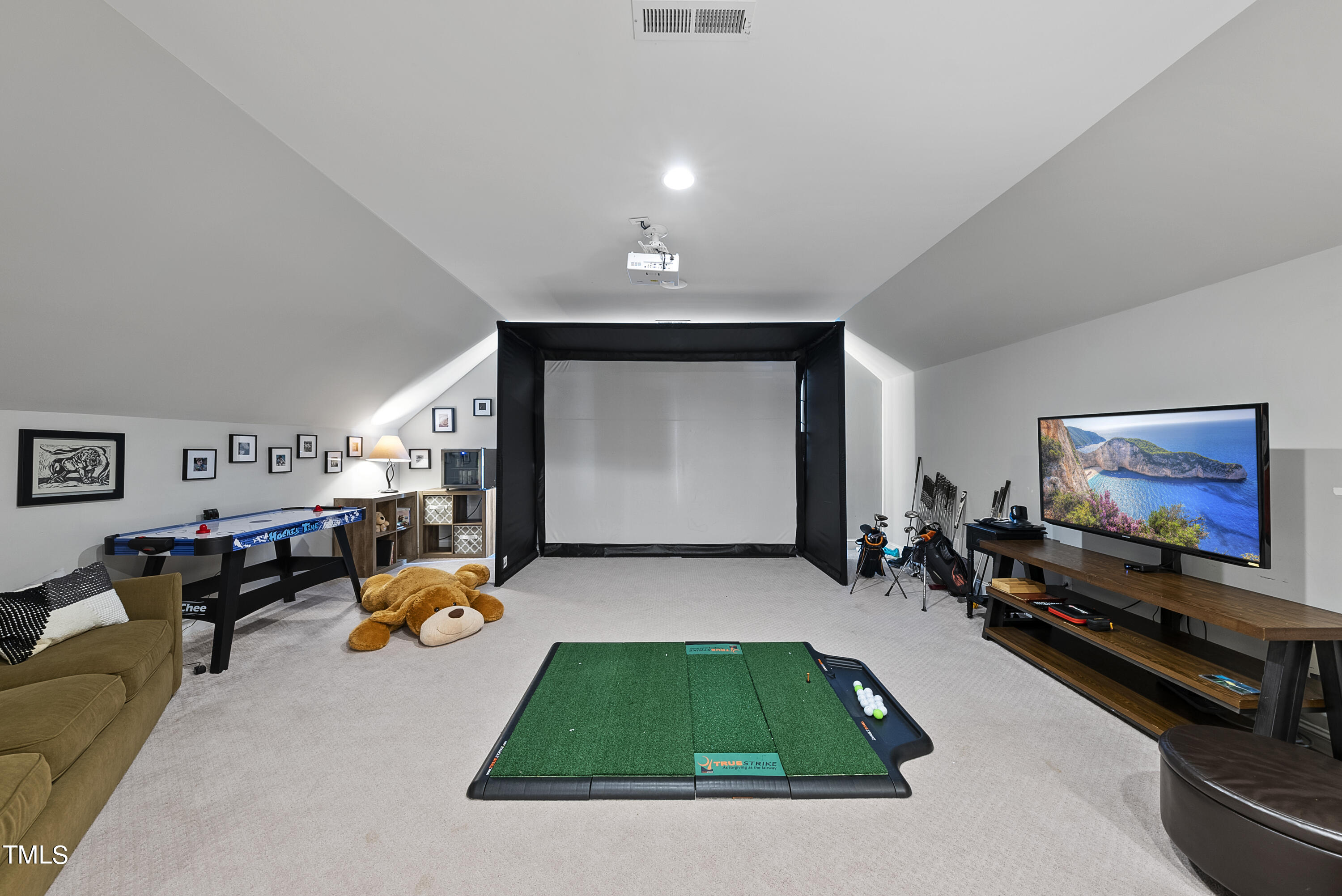 512 Mial Street Raleigh, NC 27608 - Photo 22 of 32 a living room with furniture pool and flat screen tv