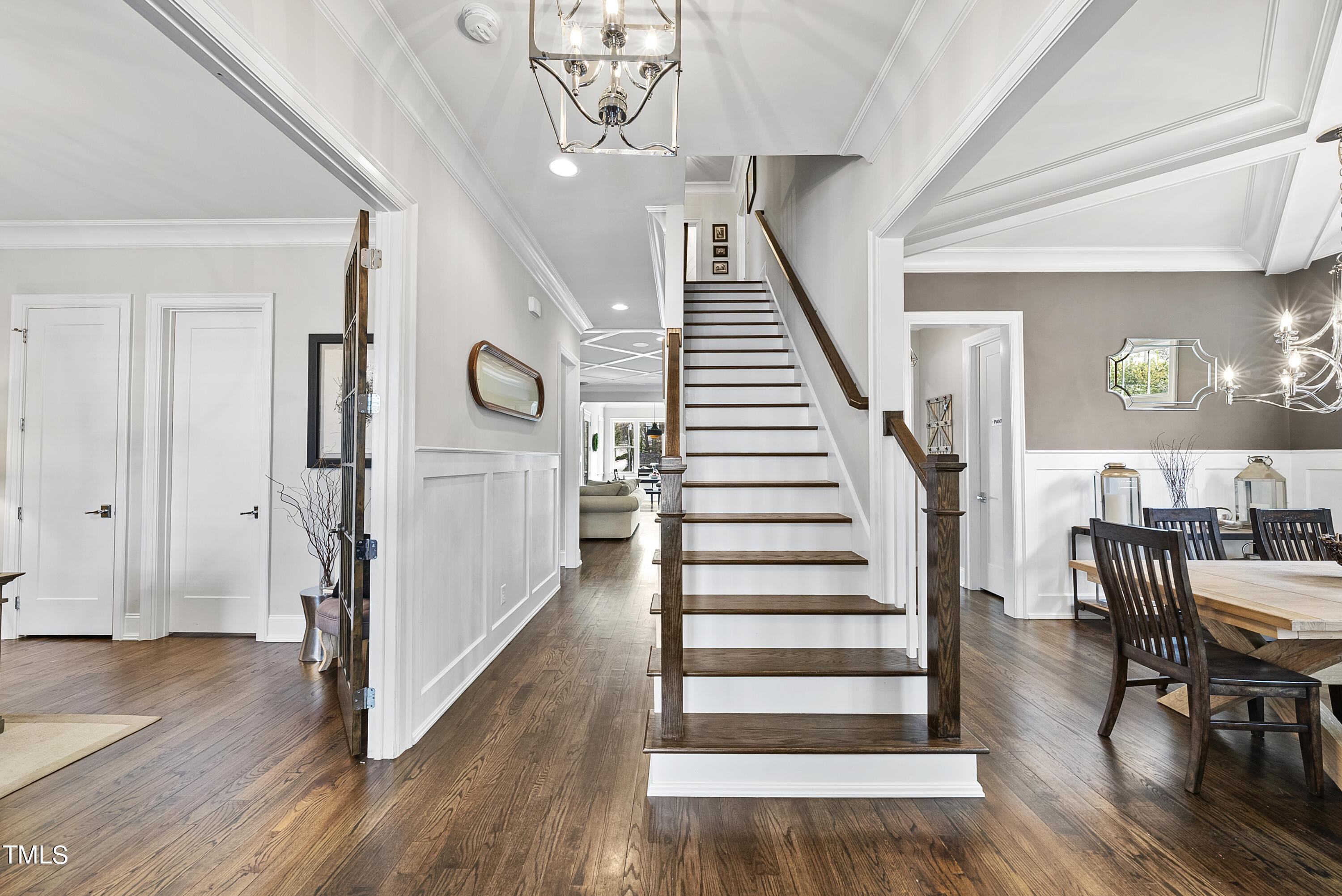 512 Mial Street Raleigh, NC 27608 - Photo 4 of 32 a view of a hallway with wooden floor and staircase
