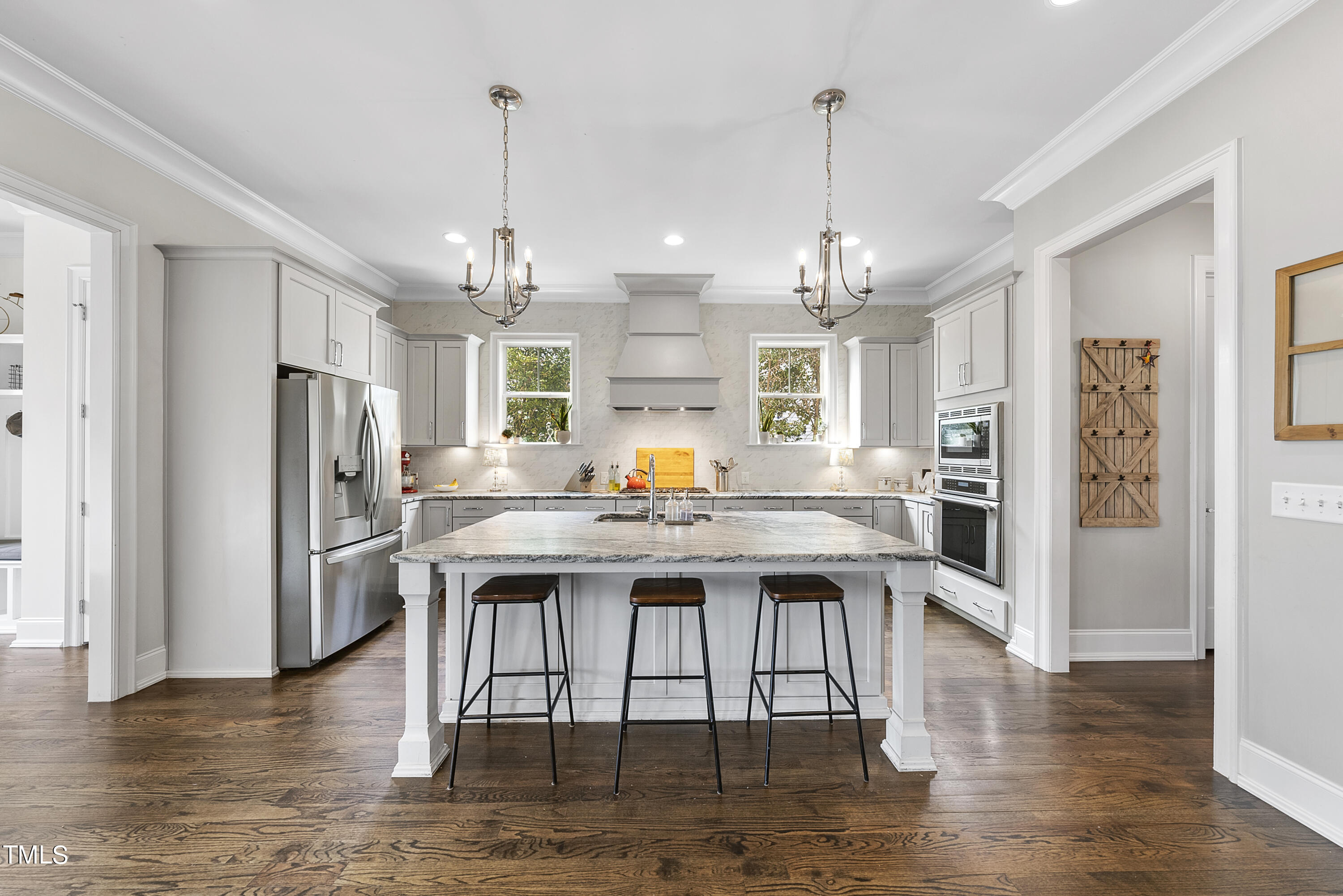 512 Mial Street Raleigh, NC 27608 - Photo 10 of 32 a kitchen with stainless steel appliances granite countertop a refrigerator a stove a sink dishwasher a refrigerator and white cabinets with wooden floor