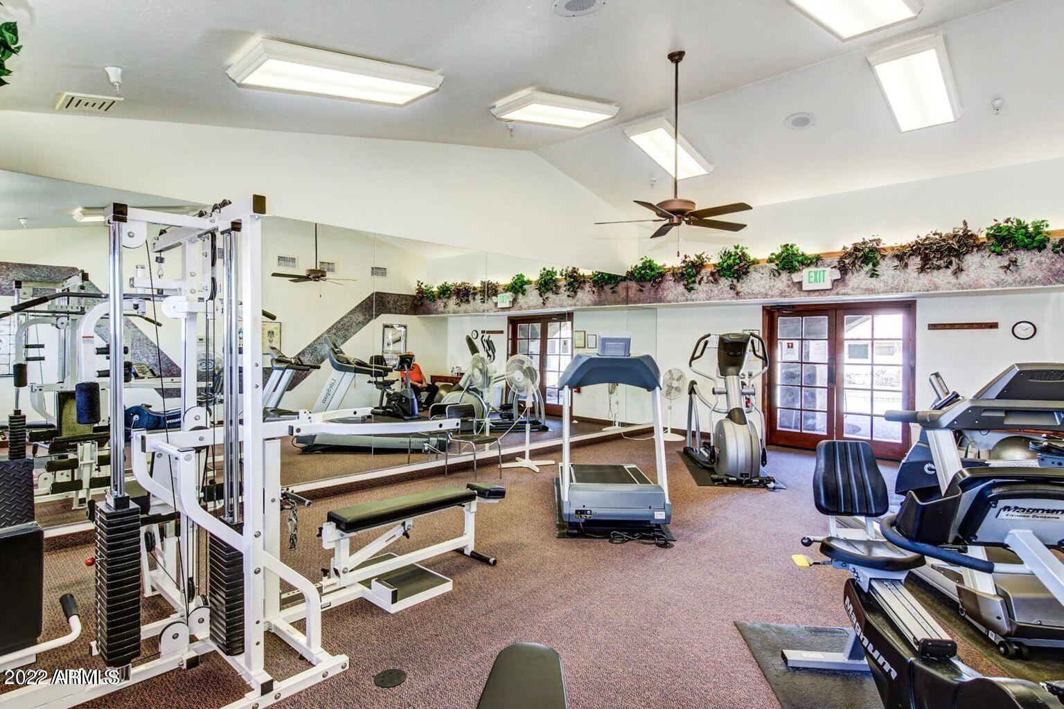 5830 East McKellips Road, Unit 76 Mesa, AZ 85215 - Photo 30 of 33 a view of a room with gym equipment