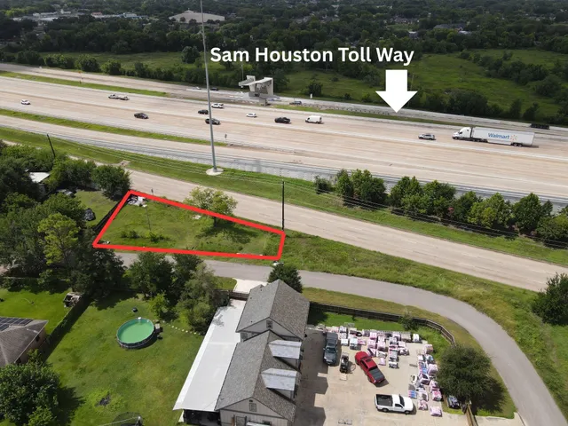 a view of a bench in patio with plants and wooden fence