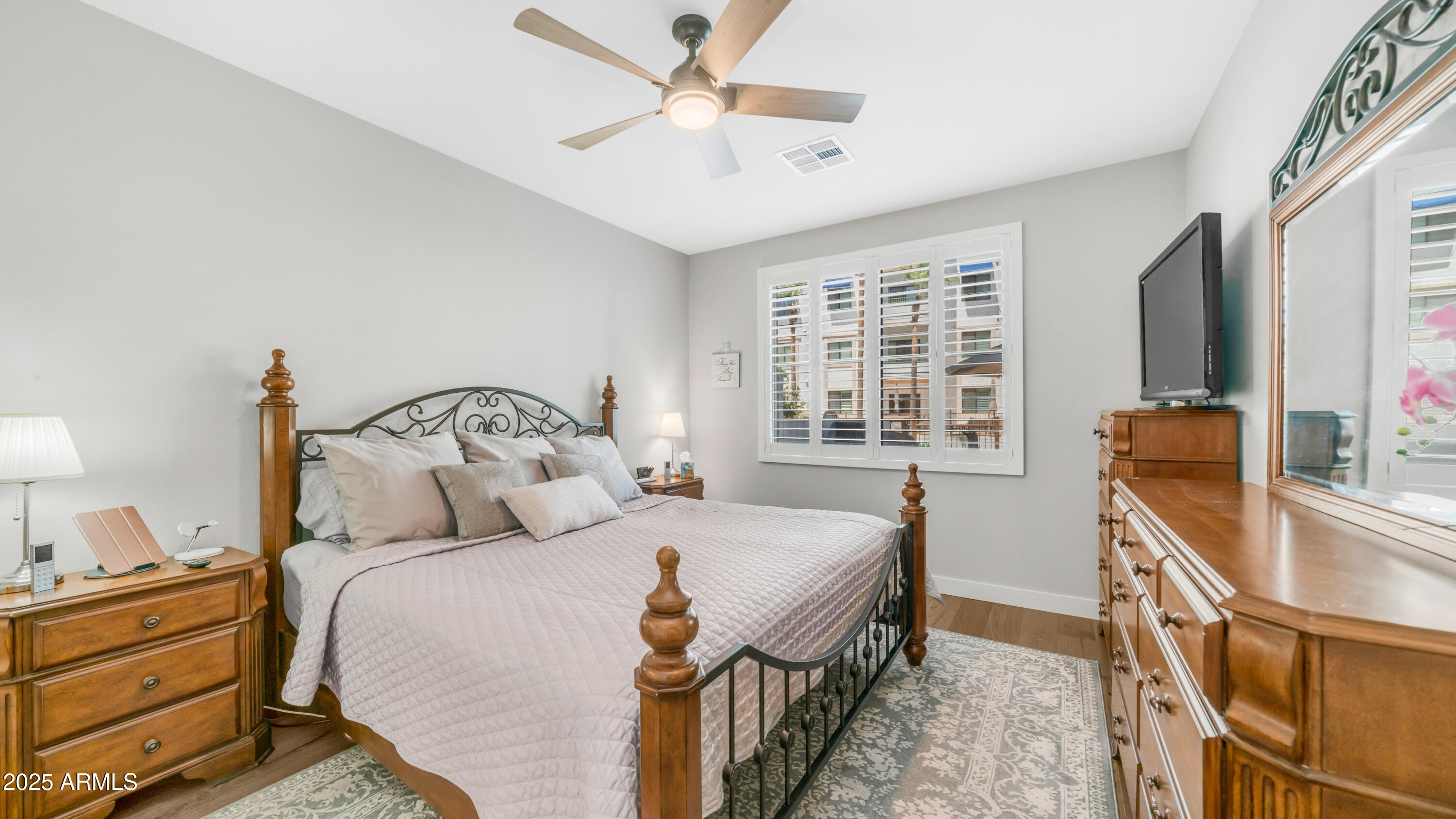 2511 West Queen Creek Road, Unit 166 Chandler, AZ 85248 - Photo 17 of 66 a bedroom with a bed and a large window with the outer view