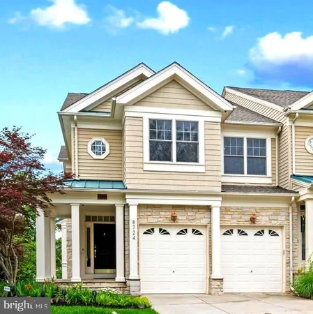 a front view of a house with garage