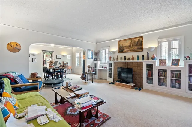 a bedroom with furniture and a balcony
