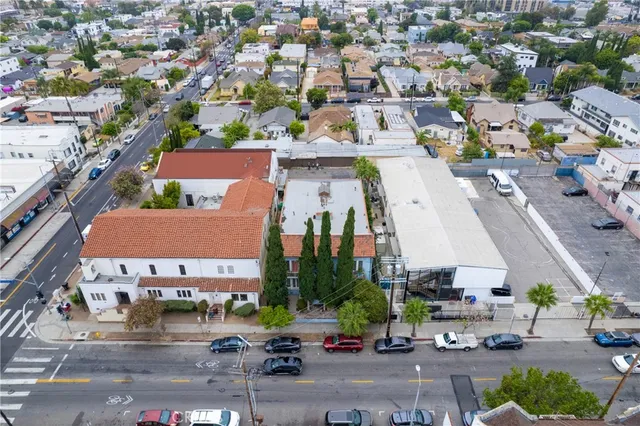aerial view of a house with a yard and plants