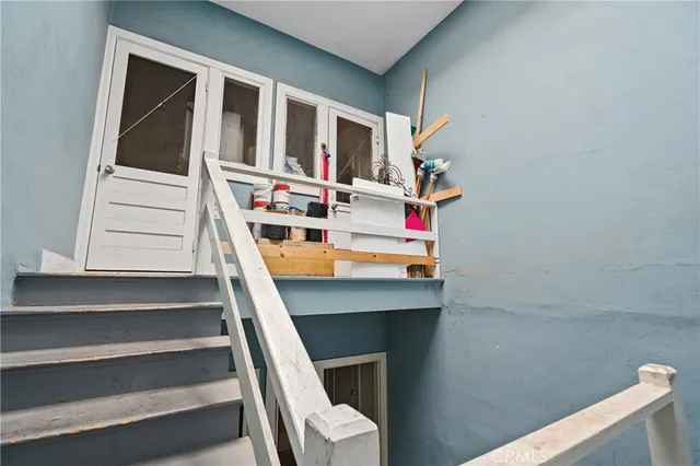 a bedroom with a bed and a bookshelf