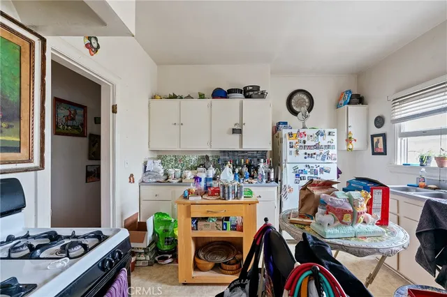 a living room with furniture a rug and a window