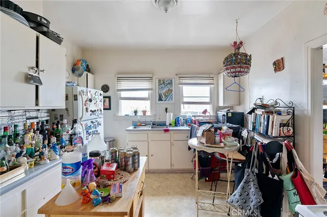 a living room with furniture a window and a flat screen tv