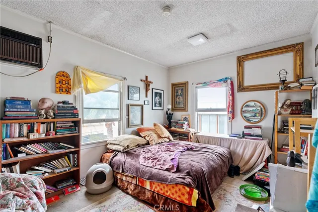 a kitchen with stainless steel appliances a white cabinets and window