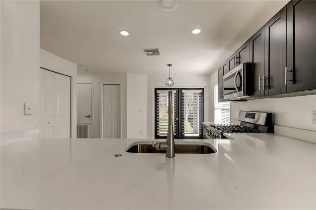 a view of a room with gym equipment and windows