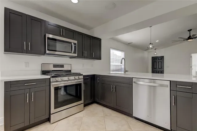 a kitchen with a sink and refrigerator