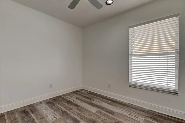 a bathroom with a double vanity sink mirror and toilet