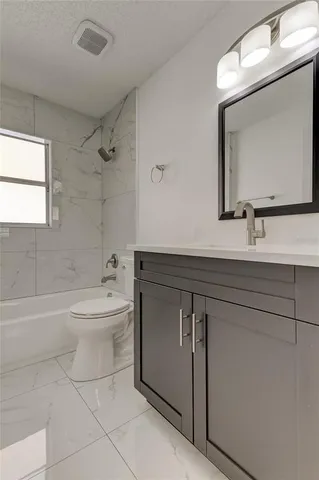 a view of a room that has a window in it