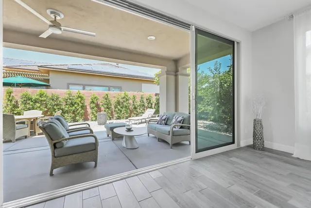 a living room with patio and furniture